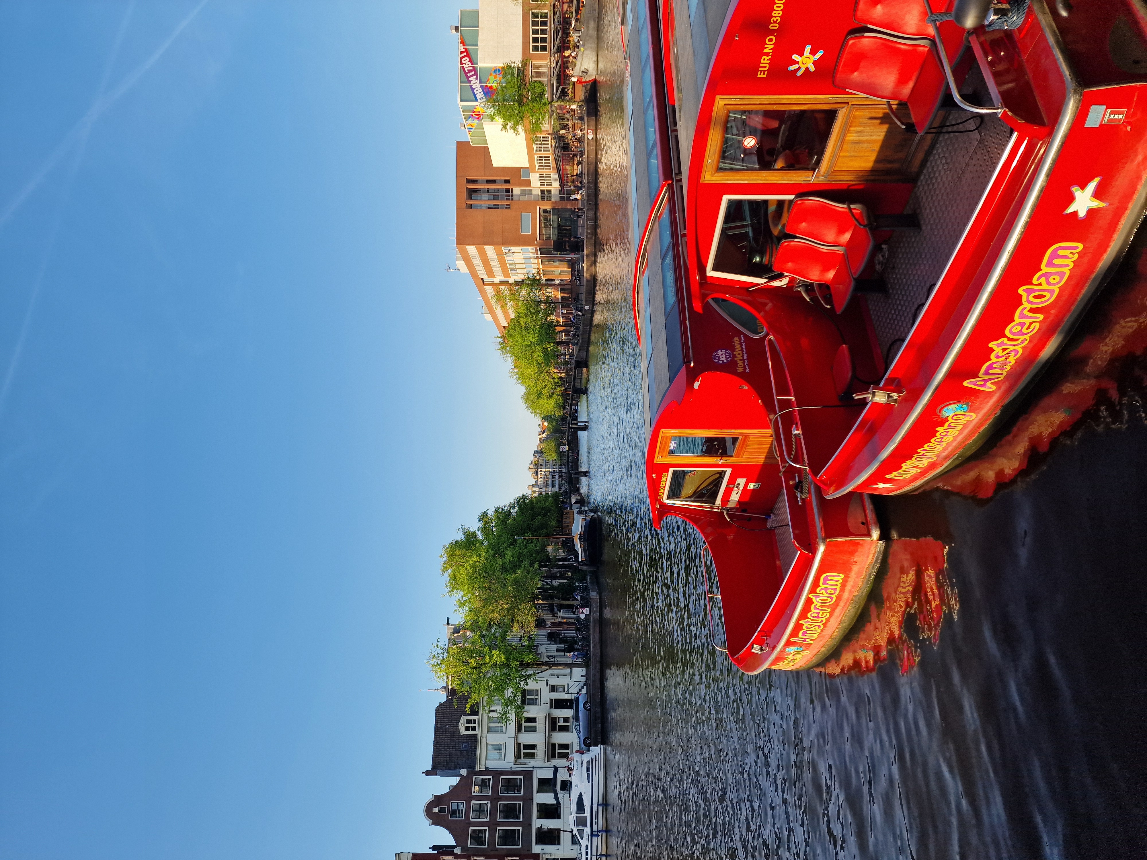 Canal with boats and houses in Amsterdam