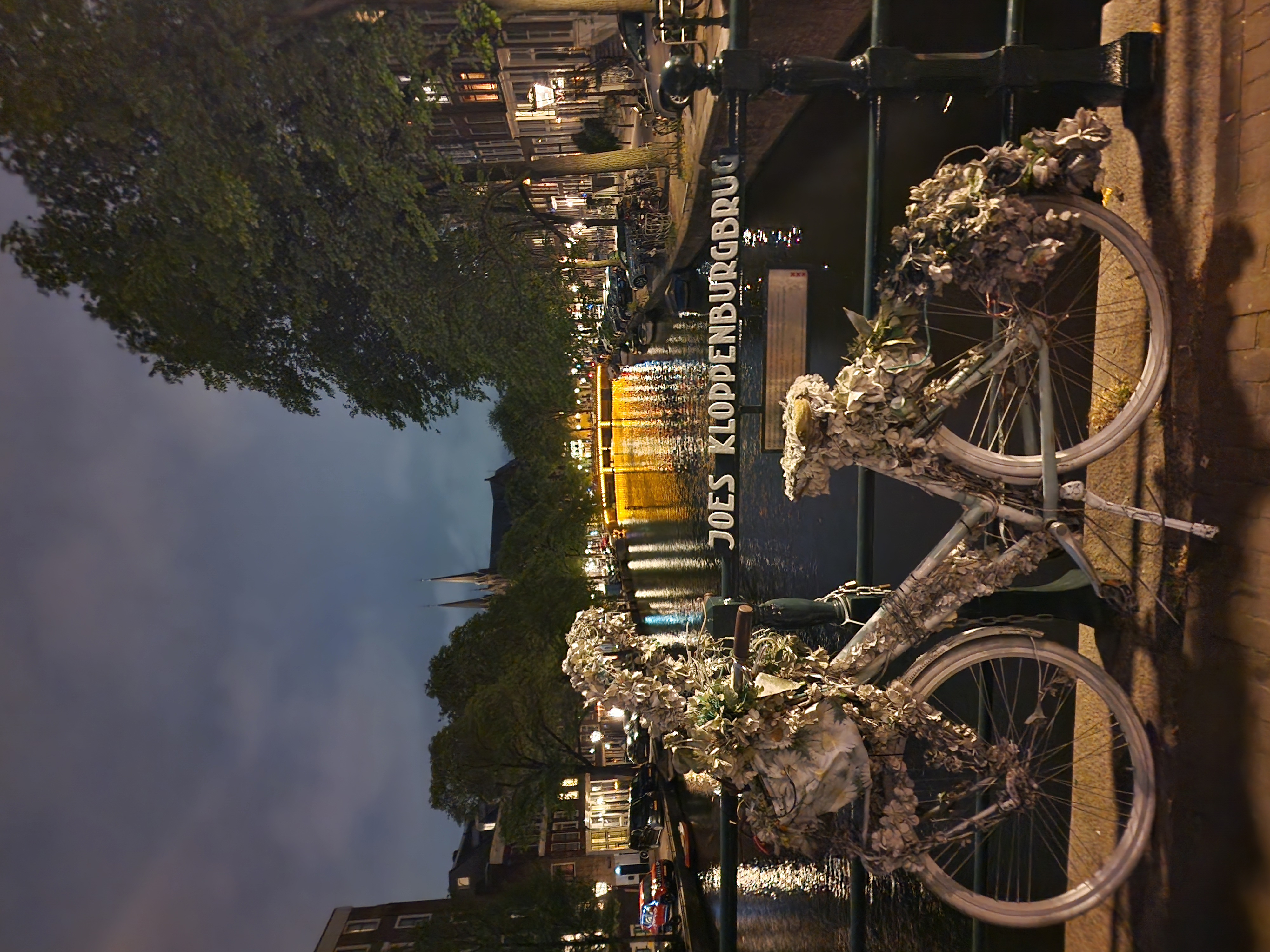 Canal in Amsterdam and flowered bike